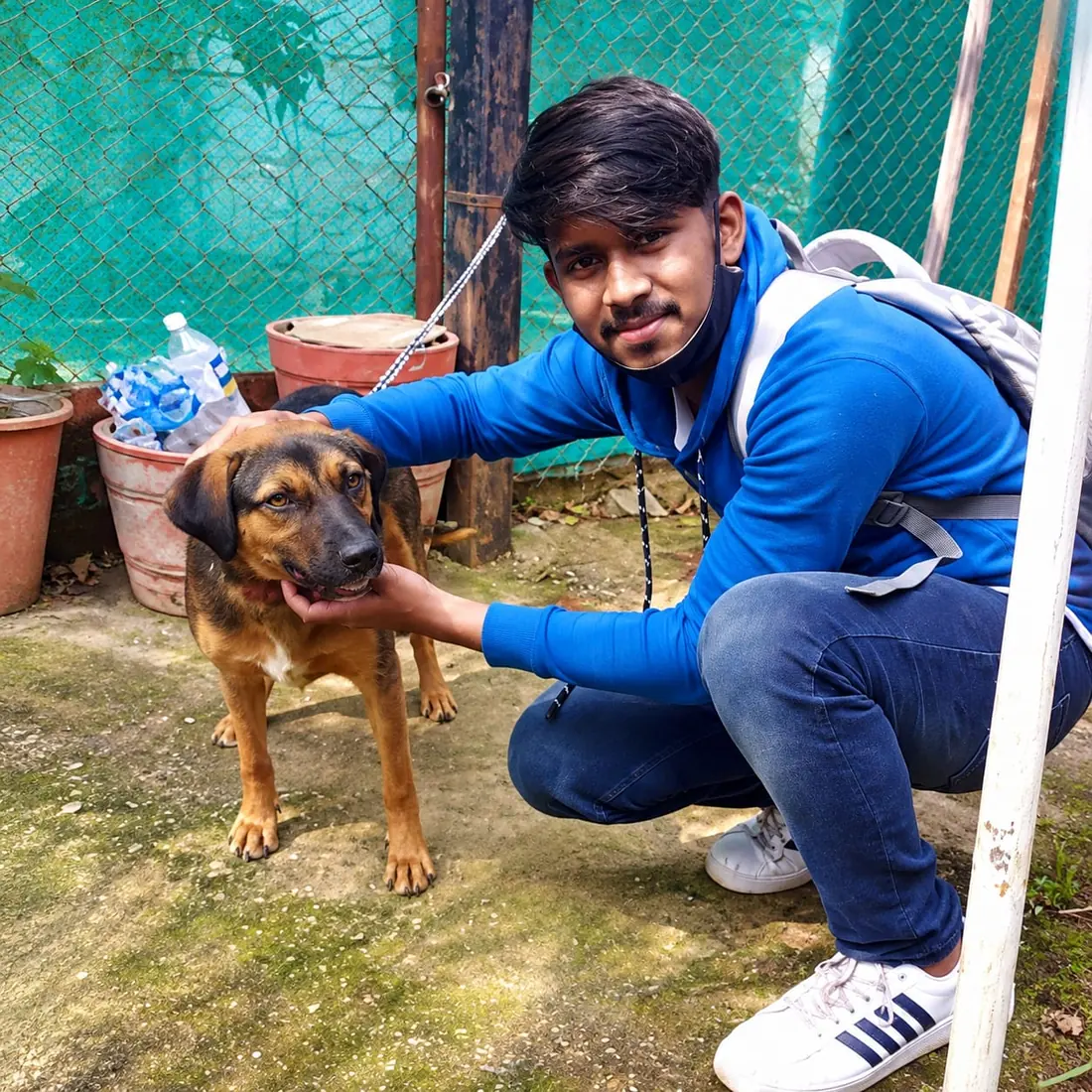 Volunteer comforting a rescued dog